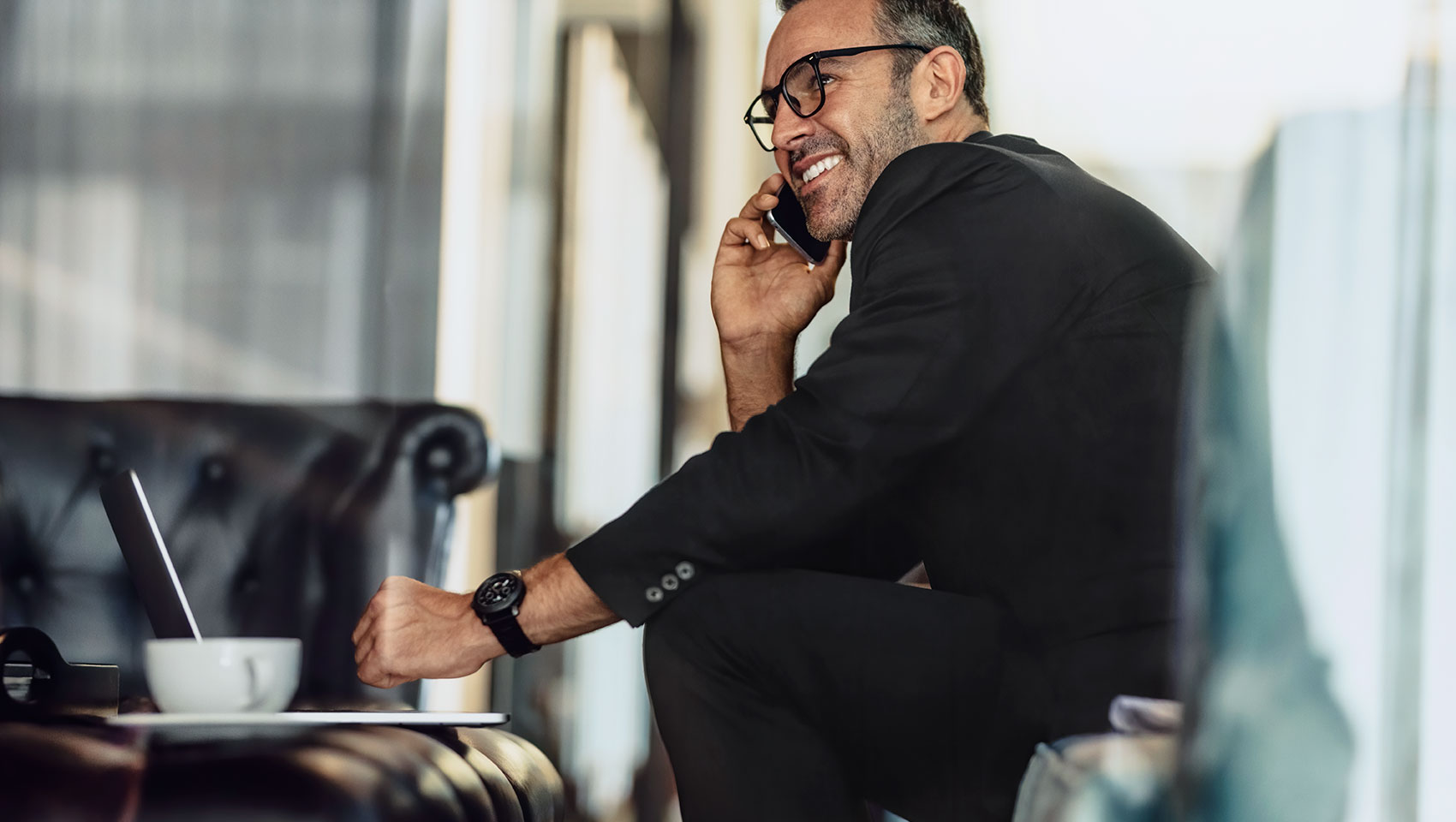 Man at Meeting on Phone